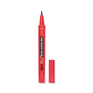 Red tube of black Benefit Cosmetics They're Real Xtreme Precision Eye Liner on white background