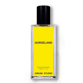 A glass fragrance bottle with a yellow label and black lettering